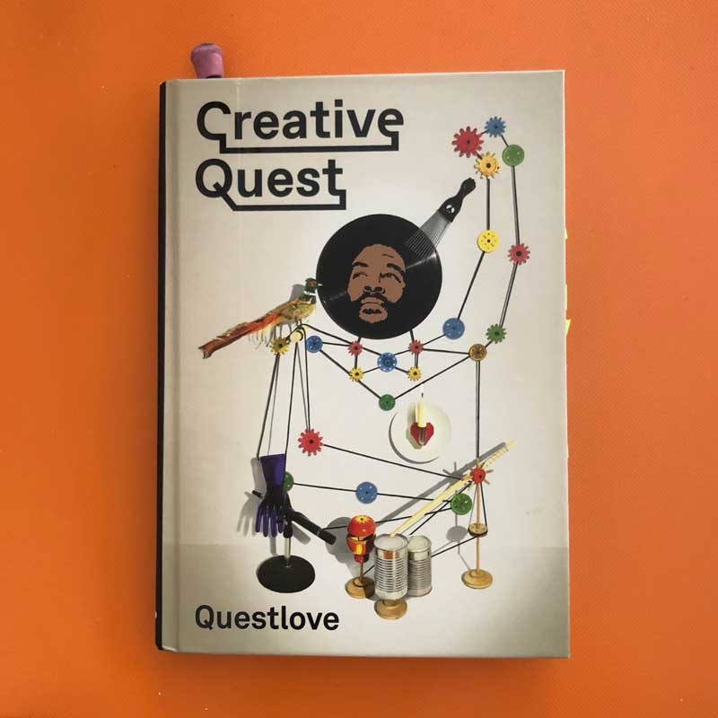 The illustrated cover of Creative Quest on an orange background