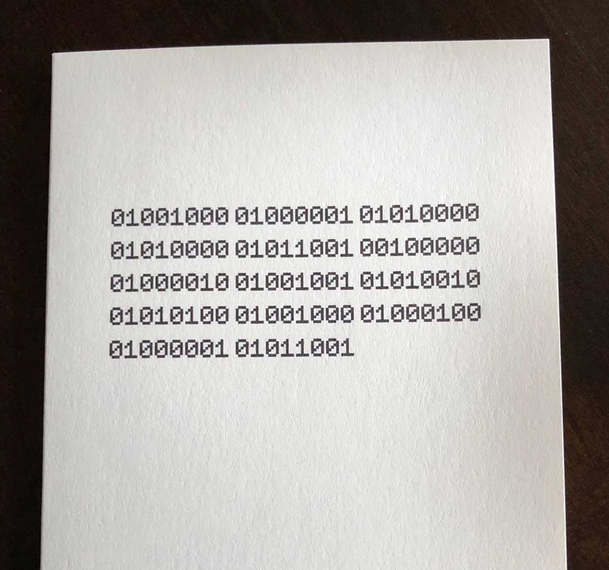 Image of a card that says "Happy Birthday" in binary 1s and 0s