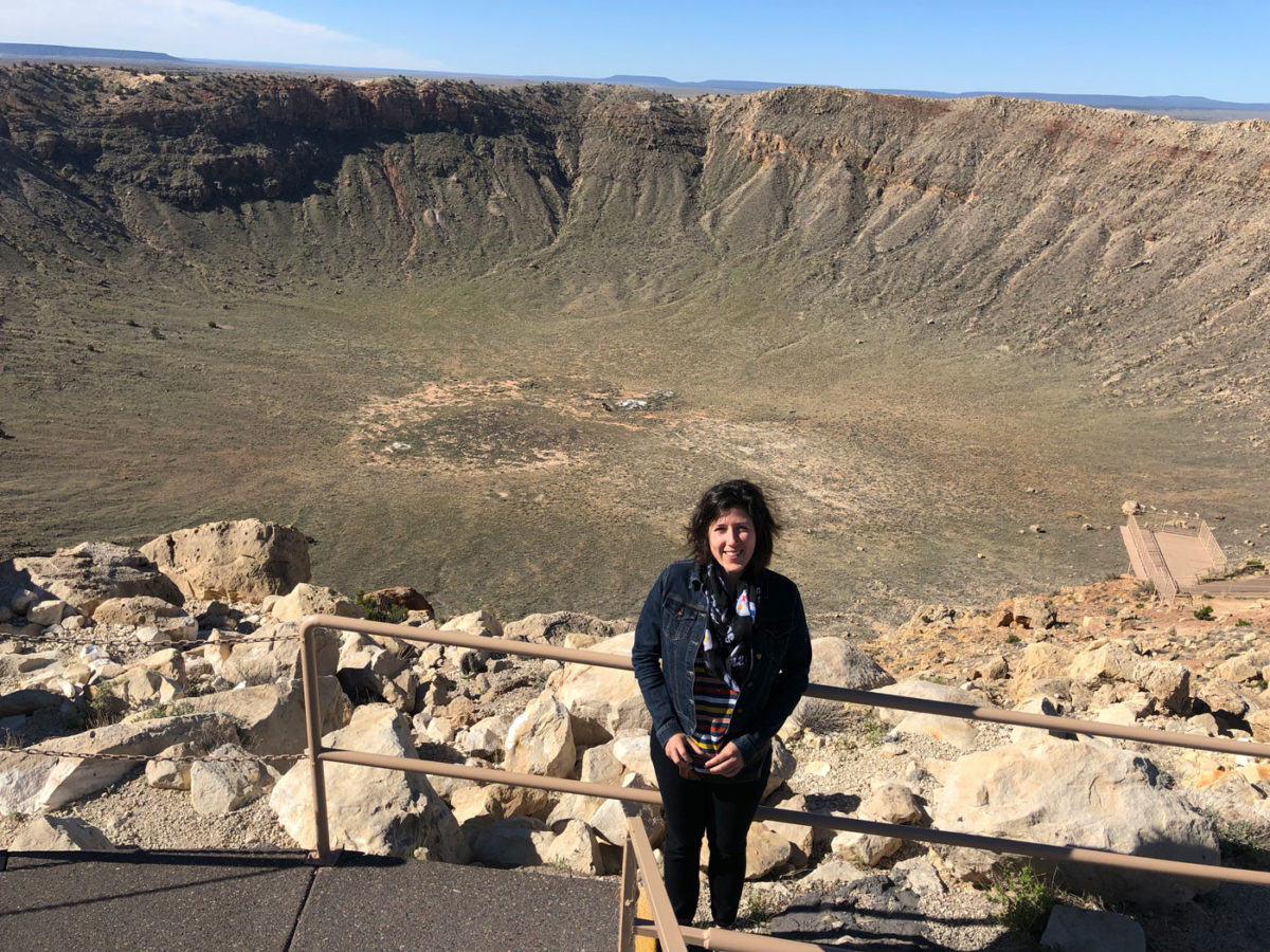 Me standing in front of a giant meteor crater