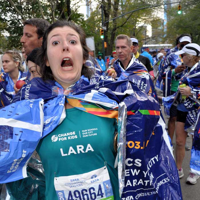 Lara with a suprised, funny expression after finishing the marathon